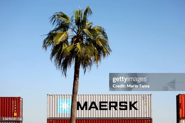 Maersk shipping container sits on a rail car at the Port of Los Angeles on February 9, 2022 in San Pedro, California. Danish container shipping...