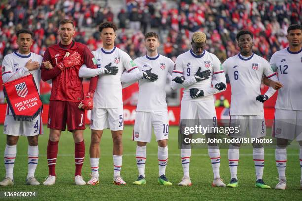 Tyler Adams, Matt Turner, Antonee Robinson, Christian Pulisic, Gyasi Zardes, Yunus Musah and Miles Robinson of the United States stand during the...