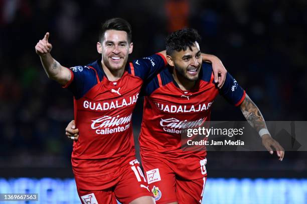 Jesus Ricardo Angulo of Chivas celebrates with Alexis Vega after scoring his team's third goal during the 4th round match between FC Juarez and...