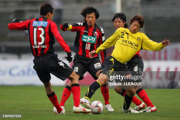Yuki Otsu of Kashiwa Reysol competes for the ball against Consadole Sapporo defense during the J.League Yamazaki Nabisco Cup Group C match between...