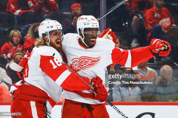 Marc Staal and Givani Smith of the Detroit Red Wings celebrate a goal by Smith during the third period against the Philadelphia Flyersat Wells Fargo...