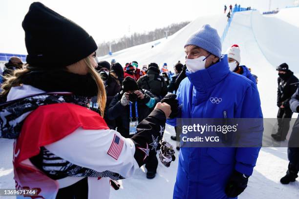 Thomas Bach , President of the International Olympic Committee , congratulates gold medalist Chloe Kim of Team United States after the Women's...