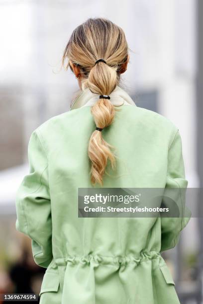 Influencer Gitta Banko wearing a low bubble ponytail hairstyle and a pastel green jacket by Petar Petrov, all by Breuninger during a street style...