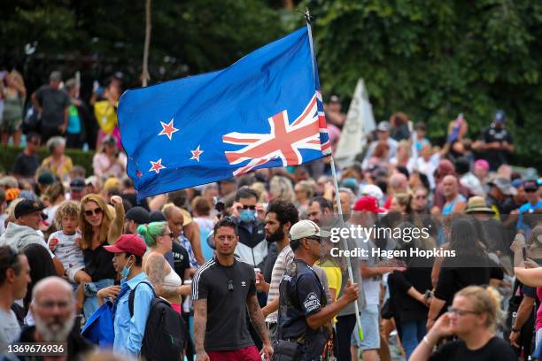 New Zealand flag is flown upside-down during a protest at Parliament on February 10, 2022 in Wellington, New Zealand. Anti-vaccine and Covid-19...