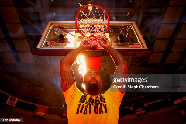 DeAndre Jordan of the Los Angeles Lakers hangs his hands on the hoop as flames shoot from behind before the game against the Portland Trail Blazers...