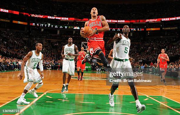 Derrick Rose of the Chicago Bulls dunks the ball against the Boston Celtics on January 13, 2012 at the TD Garden in Boston, Massachusetts. NOTE TO...