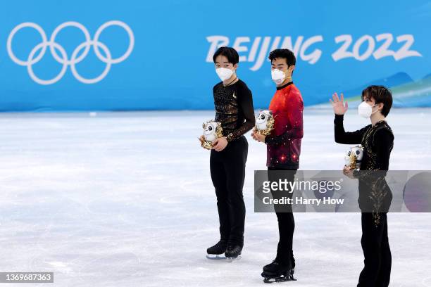 Gold medalist Nathan Chen of Team United States , Silver medalist Yuma Kagiyama of Team Japan , and Bronze medalist Shoma Uno of Team Japan pose...