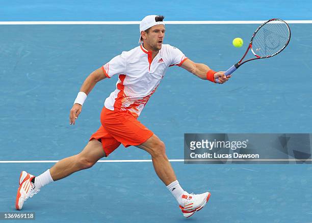 Jurgen Melzer of Austria plays a forehand during his match against Gael Monfils of France during day four of the 2012 Kooyong Classic at Kooyong on...