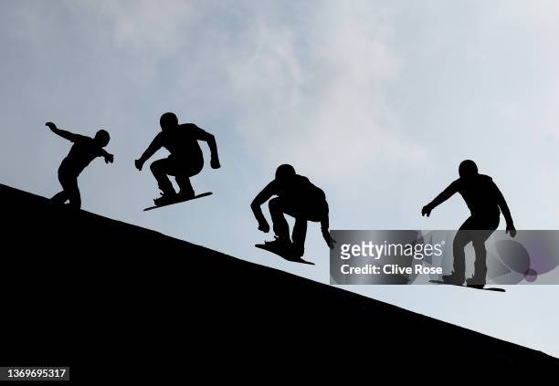 Athletes compete during the Men's Snowboard Cross Quarter Finals on Day 6 of the Beijing 2022 Winter Olympics at Genting Snow Park on February 10,...