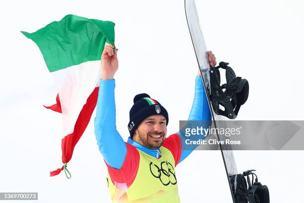 Bronze medallist Omar Visintin of Team Italy celebrates during the Men's Snowboard Cross final flower ceremony on Day 6 of the Beijing 2022 Winter...