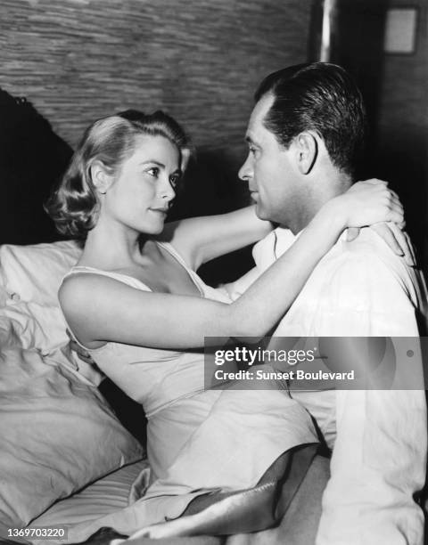 Grace Kelly and William Holden on the set of "The Bridges at Toko-Ri" directed by Mark Robson.