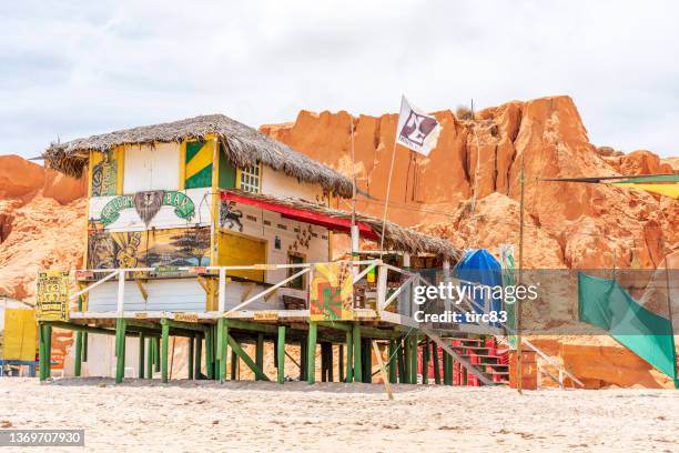 large wooden building on beach at canoa quebrada - canoa quebrada stock pictures, royalty-free photos & images