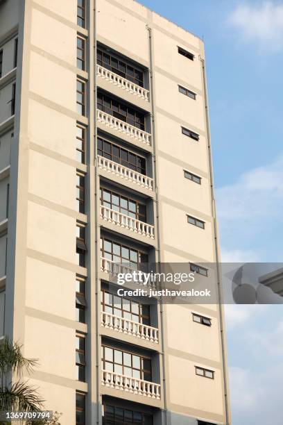 side of building close to cru university campus in bangkok - fensterfront bildbanksfoton och bilder