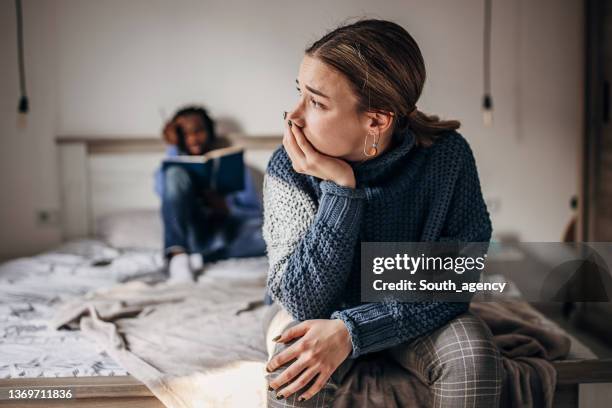 couple problems - bed conflict stock pictures, royalty-free photos & images