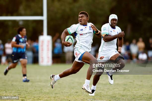 Vinaya Habosi of Fijian Drua breaks free to score a try during the Super Rugby Pacific Trial Match between the Melbourne Rebels and the Fijian Drua...