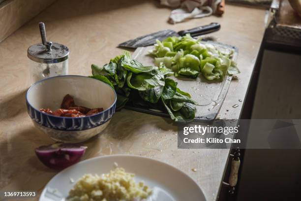fresh ingredients for making chinese food on the kitchen counter - chopping garlic stock pictures, royalty-free photos & images