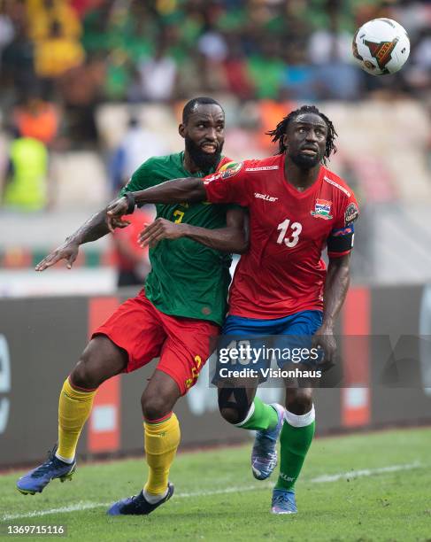 Of Gambia and NICOLAS MOUMI NGAMALEU of Cameroon during the Africa Cup of Nations 2021 quarter final football match between Gambia and Cameroon at...