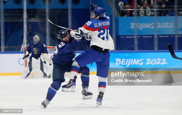 Sami Vatanen of Team Finland checks Juraj Slafkovsky of Team Slovakia in the first period during the Men's Ice Hockey Preliminary Round Group C match...