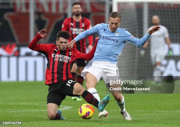 Lucas Leiva Pezzini of SS Lazio is challenged by Brahim Diaz of AC Milan during the Coppa Italia match between AC Milan ac SS Lazio at Stadio...