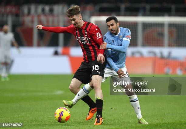 Alexis Saelemaekers of AC Milan competes for the ball with Pedro of SS Lazio during the Coppa Italia match between AC Milan ac SS Lazio at Stadio...