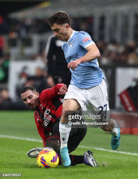 Raul Moro of SS Lazio is challenged by Ismael Bennacer of AC Milan during the Coppa Italia match between AC Milan ac SS Lazio at Stadio Giuseppe...