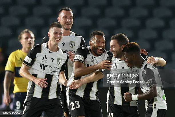 Adrian Mariappa of the Bulls celebrates his goal with team mates during the round 12 A-League Men's match between Central Coast Mariners and...