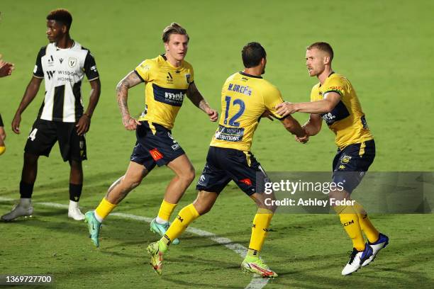 Oliver Bozanic of the Mariners celebrates his penalty goal with team mates during the round 12 A-League Men's match between Central Coast Mariners...