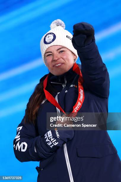Bronze medallist, Krista Parmakoski of Team Finland celebrates with their medal during the Women's 10km Classic medal ceremony on Day 6 of the...