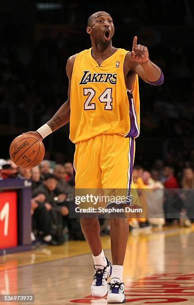 Kobe Bryant of the Los Angeles Lakers sgnals his offense as he controls the ball against against the Cleveland Cavaliers at Staples Center on January...