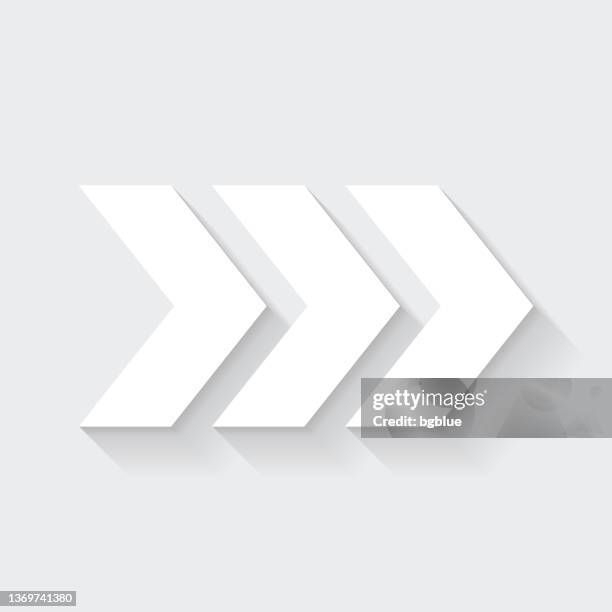 triple chevrons pointing right. icon with long shadow on blank background - flat design - chevron pattern stock illustrations