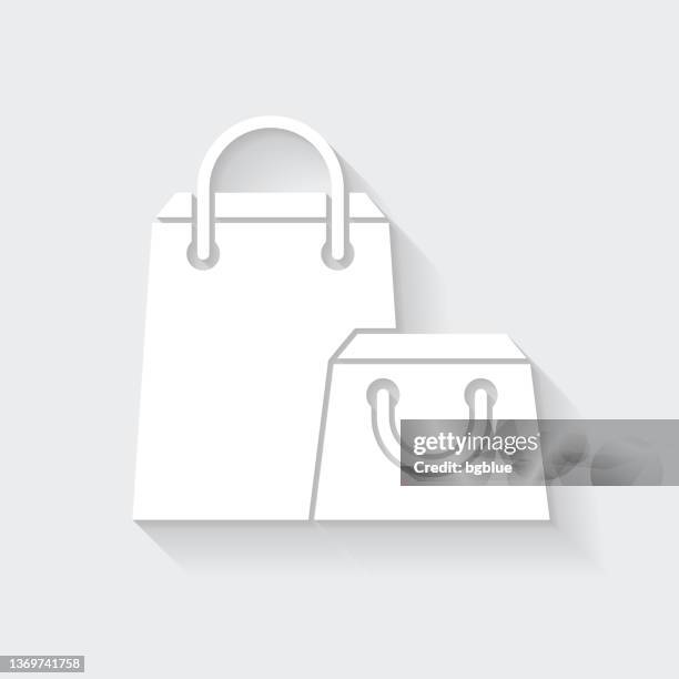 ilustrações, clipart, desenhos animados e ícones de sacolas de compras. ícone com sombra longa em fundo em branco - design plano - goodie bag