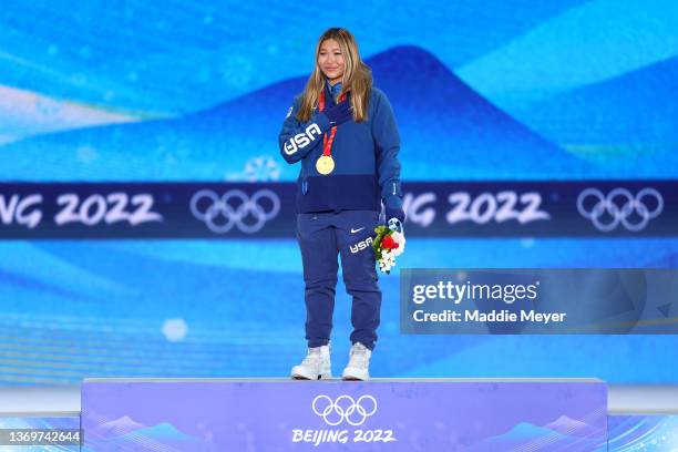 Gold medallist, Chloe Kim of Team United States celebrates on the podium during the Women's Snowboard Halfpipe medal ceremony on Day 6 of the Beijing...