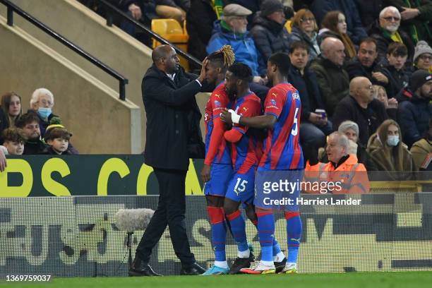 Wilfried Zaha of Crystal Palace celebrates with Patrick Vieira, Manager of Crystal Palace after scoring his team's first goal during the Premier...