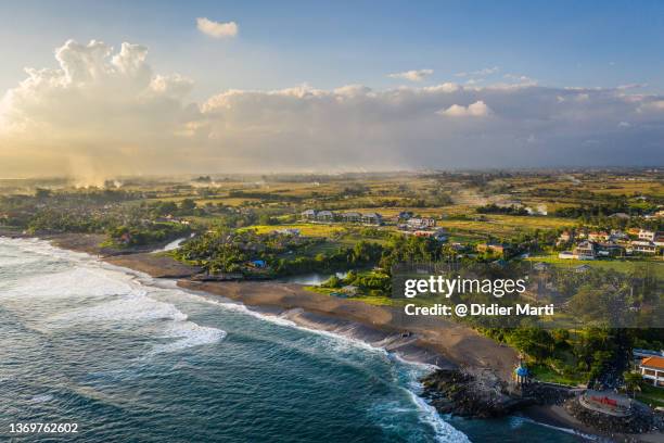 dramatic aerial view of the pererenan beach in canggu in bali, indonesia - indonesia photos stock pictures, royalty-free photos & images