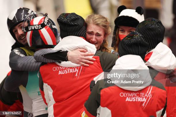 Team Austria celebrate after sliding during the Luge Team Relay on day six of the Beijing 2022 Winter Olympics at National Sliding Centre on February...