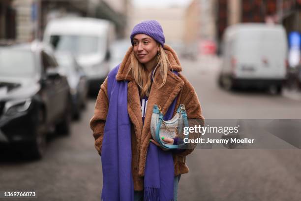 Sonia Lyson is wearing Ducie brown teddy coat, Agolde denim, Weekday lilac sweater and lilac Weekday hat, & other stories lilac scarf and Louis...