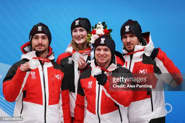 Madeleine Egle , Wolfgang Kindl , Thomas Steu and Lorenz Koller of Team Austria react after winning the silver medal for Luge Team Relay on day six...