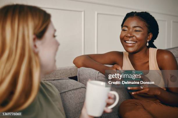 shot of two friends catching up over coffee - africa cup of nations 2010 abuja stockfoto's en -beelden