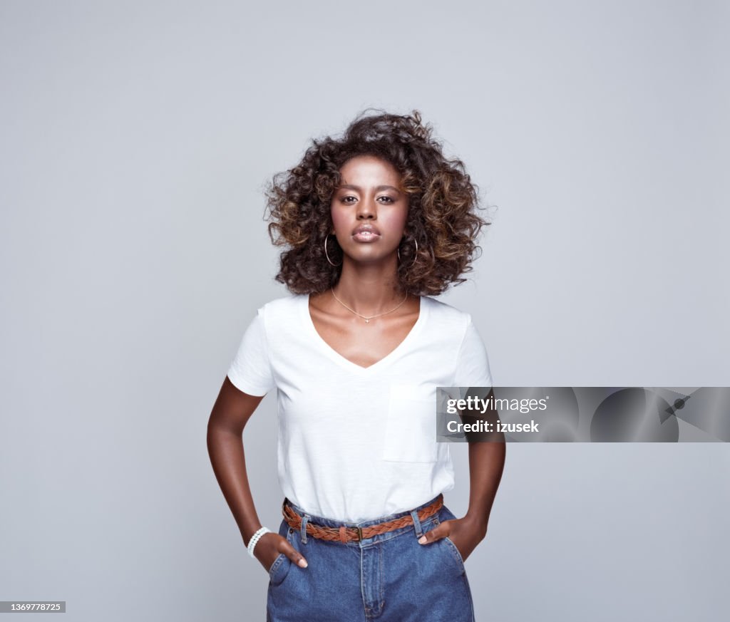 Confident young woman in white t-shirt