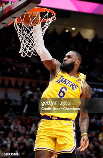 LeBron James of the Los Angeles Lakers dunks against the Portland Trail Blazers during the fourth quarter at Moda Center on February 09, 2022 in...