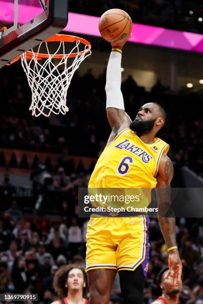 LeBron James of the Los Angeles Lakers dunks against the Portland Trail Blazers during the fourth quarter at Moda Center on February 09, 2022 in...