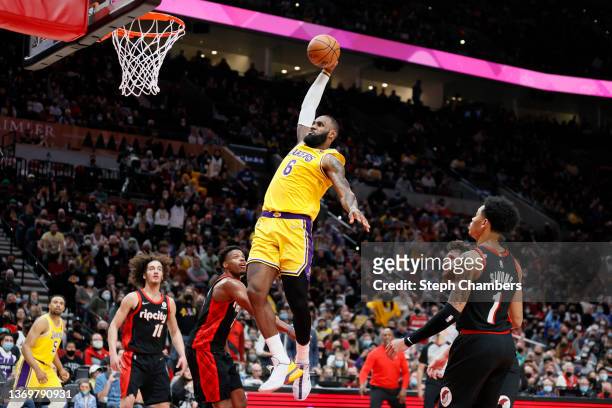 LeBron James of the Los Angeles Lakers dunks against the Portland Trail Blazers during the fourth quarter at Moda Center on February 09, 2022 in...