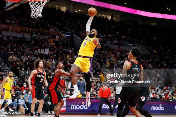 LeBron James of the Los Angeles Lakers dunks against the Portland Trail Blazers during the fourth quarter at Moda Center on February 09, 2022 in...