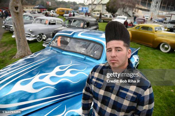 George Tantardini of Garden Grove, California was stylng with his hairdo and his blue-metallic 1953 GMC pickup truck at the 2016 Grand National...
