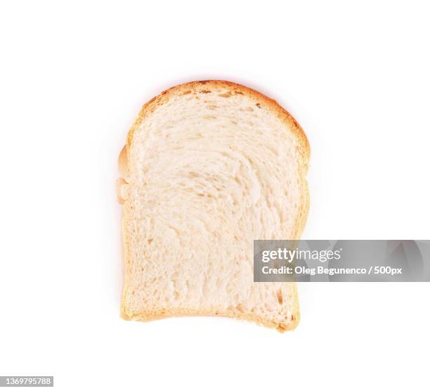 white bread slice,directly above shot of bread on white background,moldova - white bread stockfoto's en -beelden