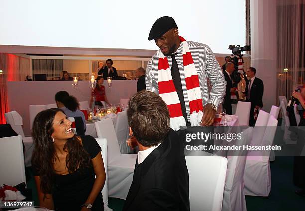 Mario Gomez and girlfriend Silvia Meichel talk to Darius Hall during the Uli Hoeness' 60th birthday celebration at Postpalast on January 13, 2012 in...