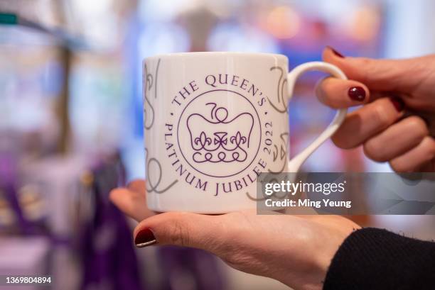 Platinum jubilee logo mug on display at the Buckingham Palace shop on February 7, 2022 in London, United Kingdom. The official Platinum Jubilee...