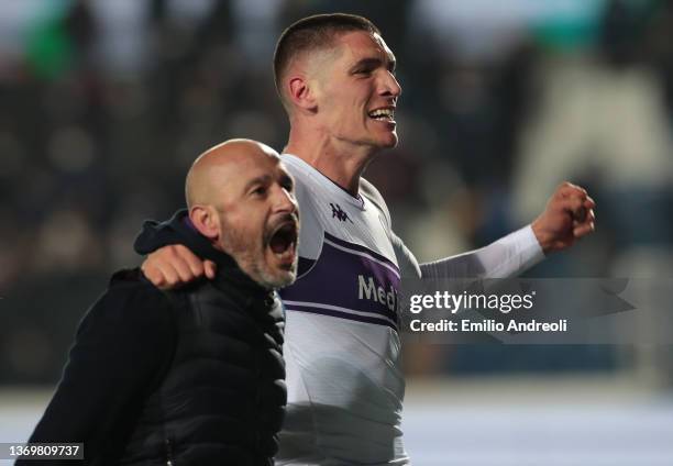 Nikola Milenkovic of ACF Fiorentina celebrates victory with his coach Vincenzo Italiano at the end of the Coppa Italia match between Atalanta BC and...