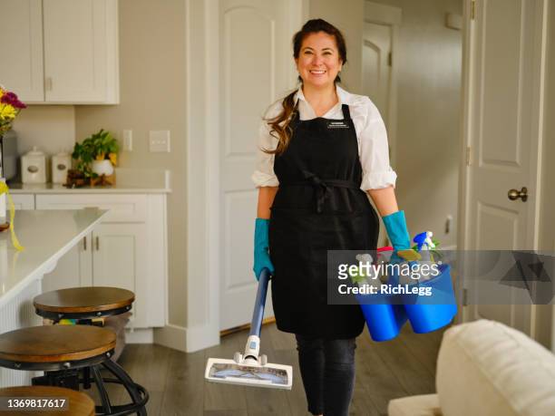 professional housecleaner at work - cleaning lady stock pictures, royalty-free photos & images