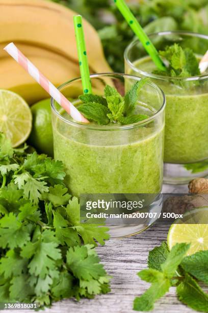 celery detox drink,close-up of drink on table - avocado smoothie stock-fotos und bilder
